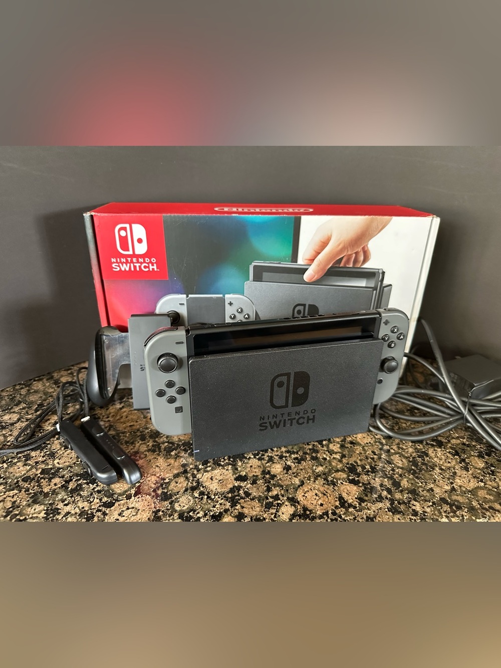 NINTENDO SWITCH OLED console with gray Joy-Con Controllers